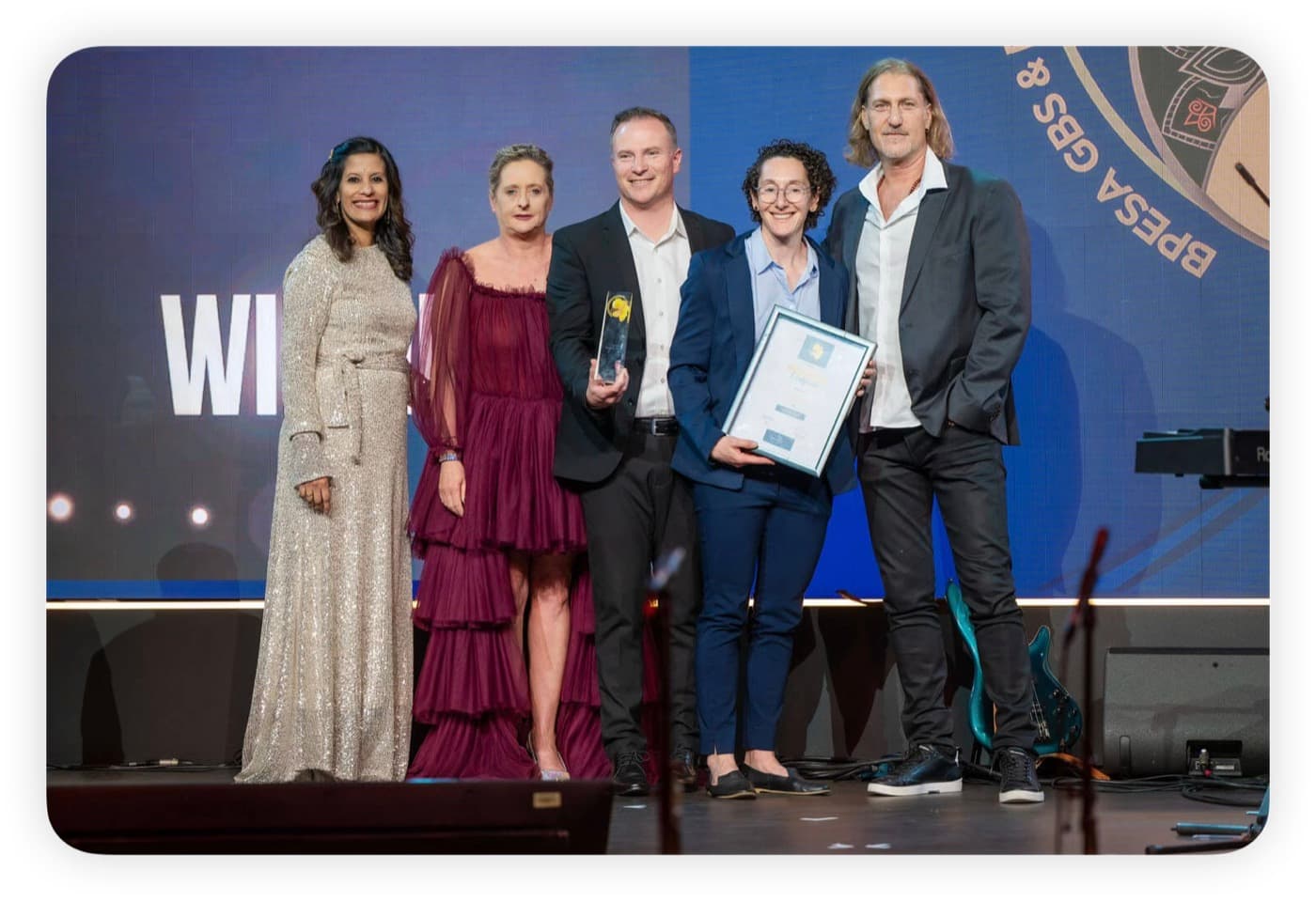 The DSG team collecting the BPESA award on stage