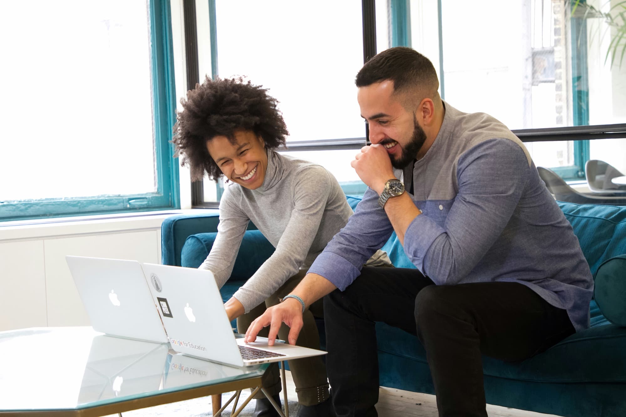 Two CX professionals working together